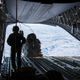 Illustration for article titled Check Out These Shots Of A C-17 Dropping Pararescuemen Over The Navy's Arctic Outpost